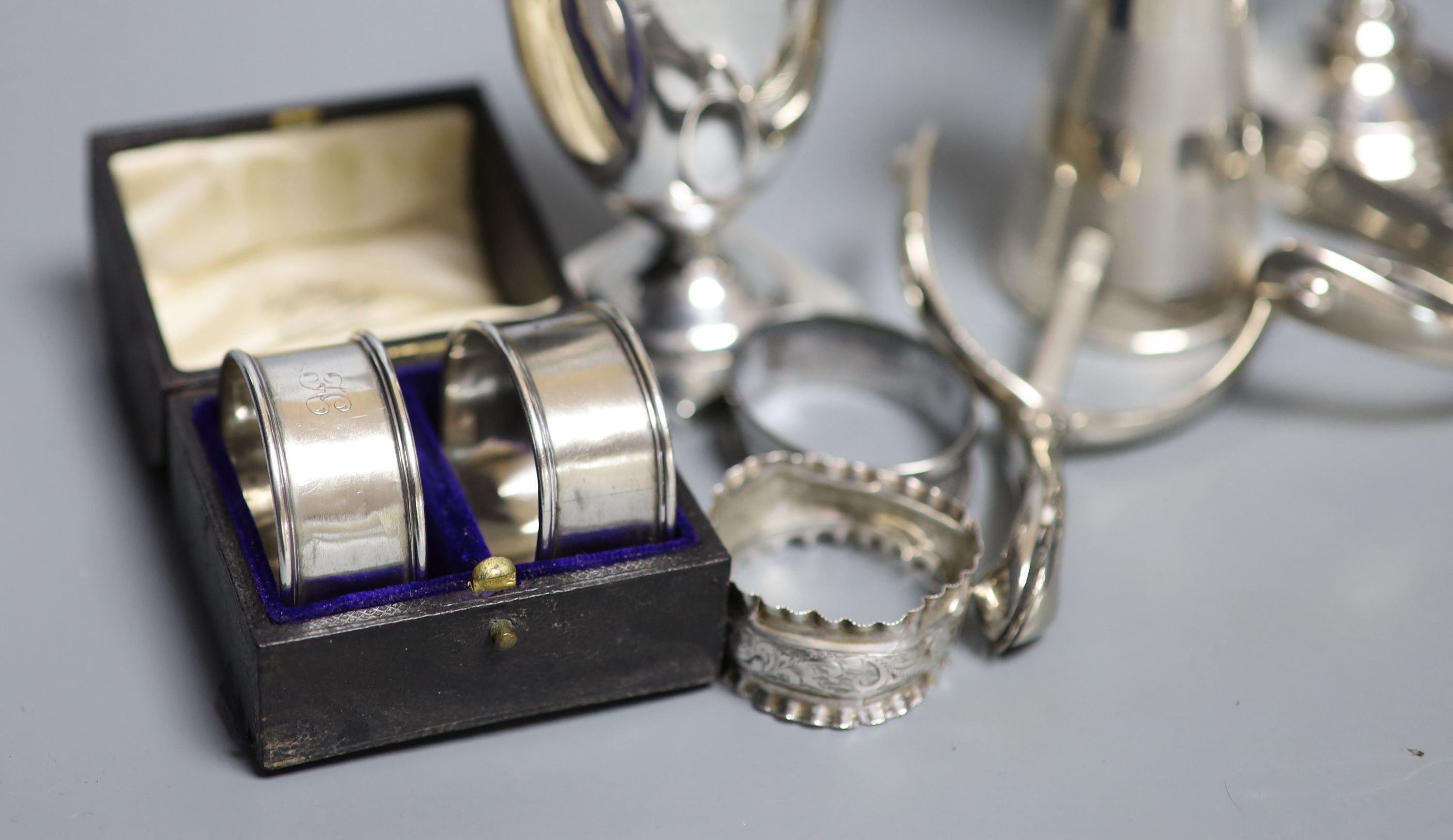 Mixed small silver lot to include a pepper mill, cream jug, christening mug, goblet, etc and a pair of metal spurs.